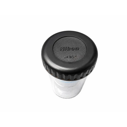 Black Nikon MRH00602 CFI microscope objective lens cap with textured grip and clear plastic body for medical equipment