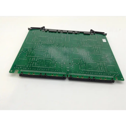 Green printed circuit board with black connectors and silver solder points of nortel meridian nt8d14bb universal trunk card