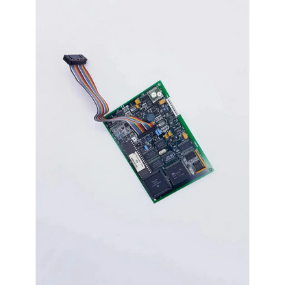 Green printed circuit board with black integrated circuits and multicolored ribbon cable connector for novametrix 25300001 controller featuring spacelabs mpc860 cpu nibp assembly board