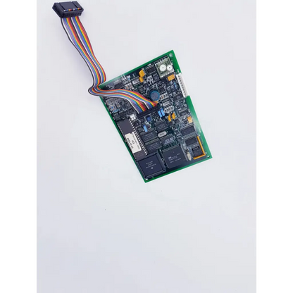 Green printed circuit board with black integrated circuits and multicolored ribbon cable for novametrix 25300001 controller featuring spacelabs mpc860 cpu nibp assembly board
