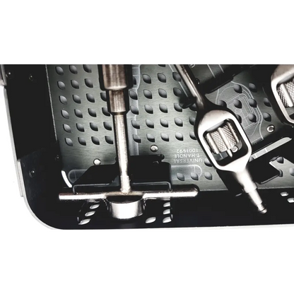 Silver surgical instrument with textured grip and metallic shaft resting in perforated xlw instrument tray nuvasive xlw