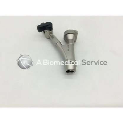 Silver surgical instrument with black knob and dual-ended design in olympus a20976a single bridge model