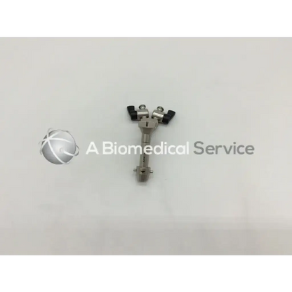 Silver surgical instrument with black plastic handles and metallic shaft for olympus a20977a horn bridge adapter w dual stopcocks