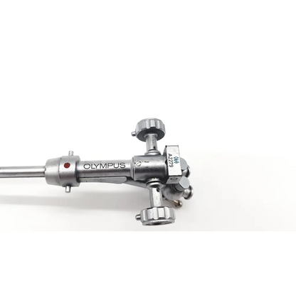 Silver metallic olympus a2279 double channel albarran bridge endoscope with cylindrical body and multiple adjustment knobs