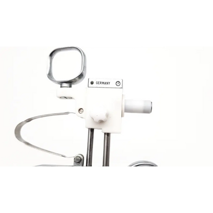White plastic and chrome metal olympus a2754 urological instrument handpiece with germany label visible