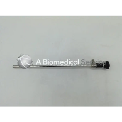 Silver olympus a5254 10mm rigid laparoscope with spherical lens and black ergonomic controls for surgical use