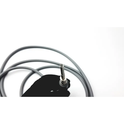 Gloved hand holding gray olympus autoclavable fiber optic light cable with metallic connector end for medical use