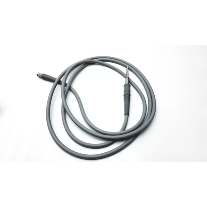 Gray olympus autoclavable fiber optic light cable with metallic tip and connector coiled neatly for medical use