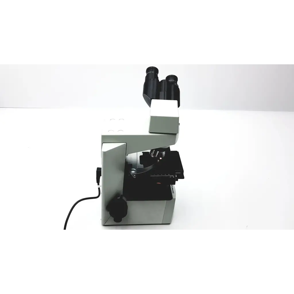 Silver and black olympus cx41rf microscope with dual eyepieces designed for advanced laboratory use