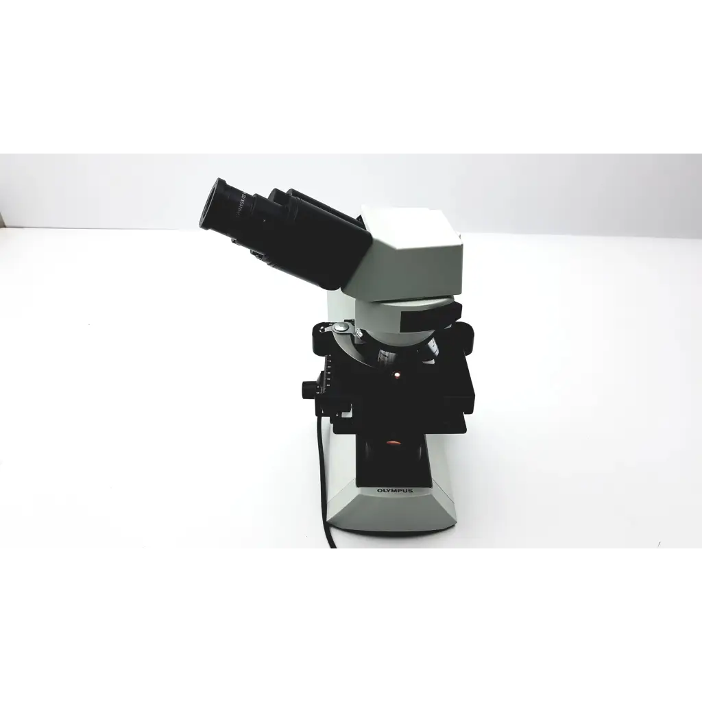 Black and silver olympus cx41rf microscope with dual eyepieces and sturdy base for laboratory use