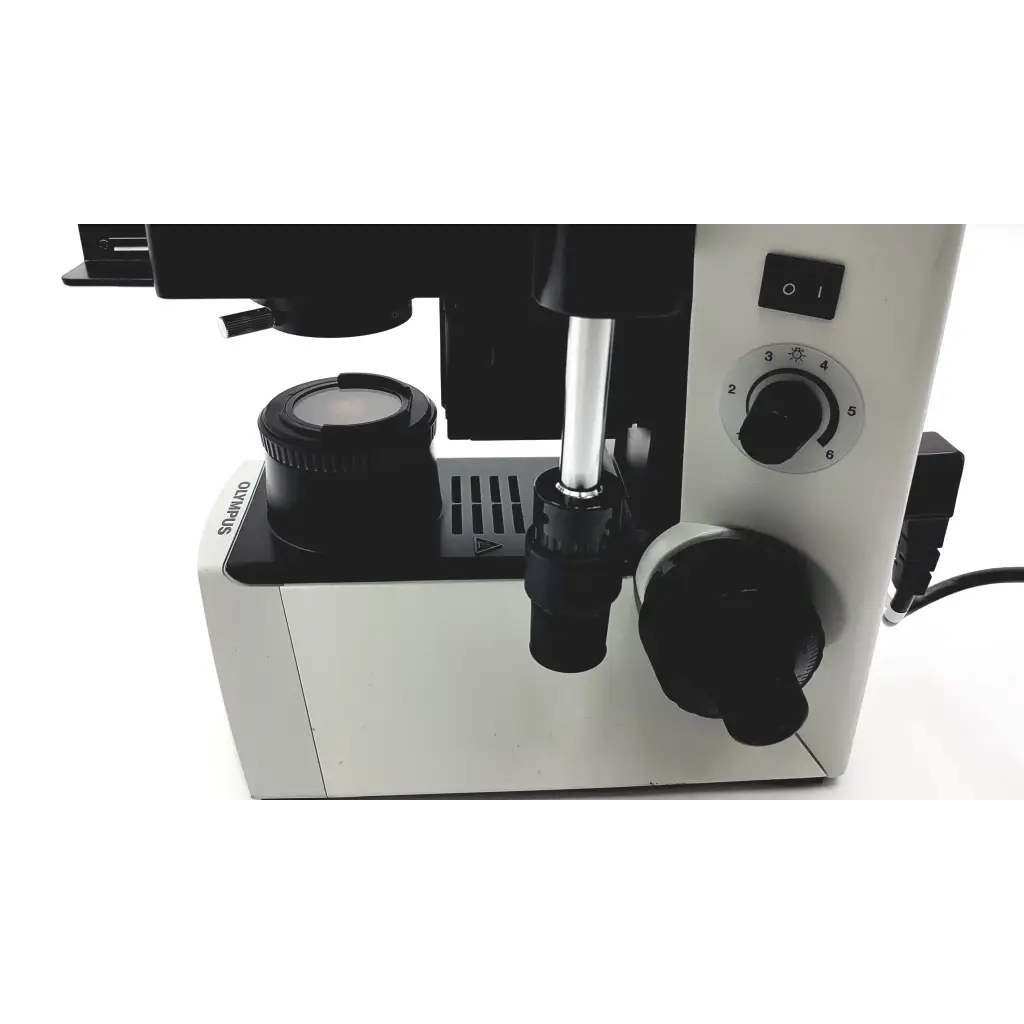 White and black olympus cx41rf microscope with adjustable focus knobs and circular light control dial for precise imaging