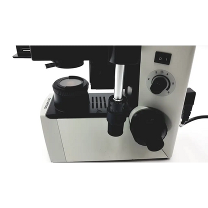 White and black olympus cx41rf microscope with adjustable focus knobs and circular light control dial for precise imaging