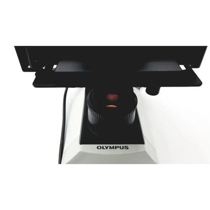 Black and white olympus cx41rf microscope with a red-lit objective lens for detailed laboratory analysis