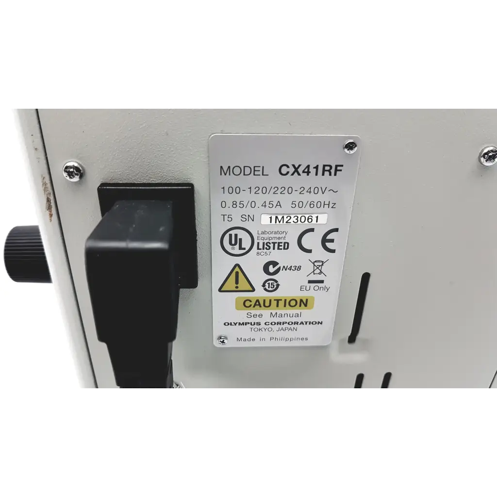 White olympus cx41rf microscope with black power switch and certification label on laboratory equipment surface