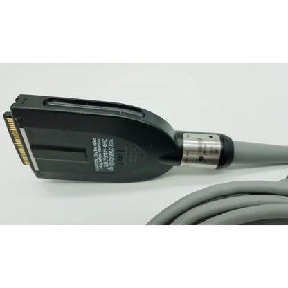 Black plastic connector with gold contacts and silver band on gray cable for Olympus OTV-S7ProH autoclavable camera head