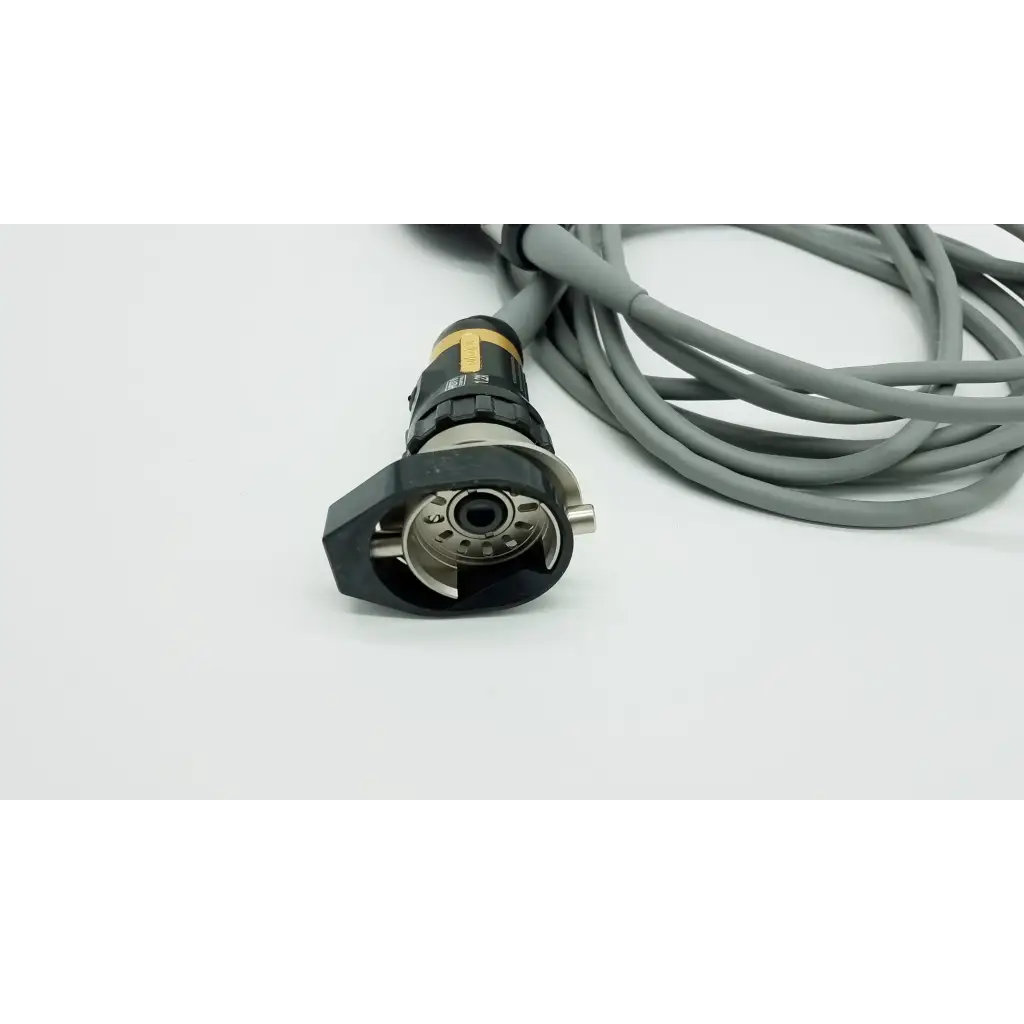 Black and gold industrial connector with gray cable on the back of olympus otv-s7proh-hd-12e autoclavable camera head