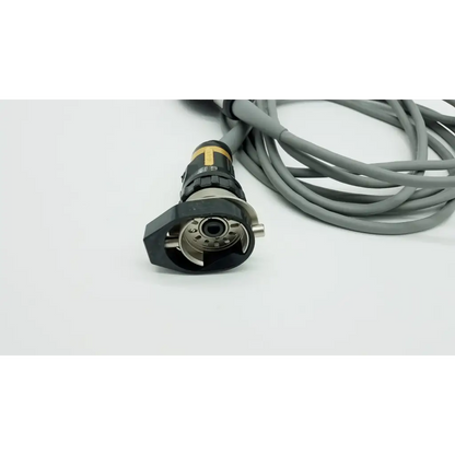 Black and gold industrial connector with gray cable on the back of olympus otv-s7proh-hd-12e autoclavable camera head