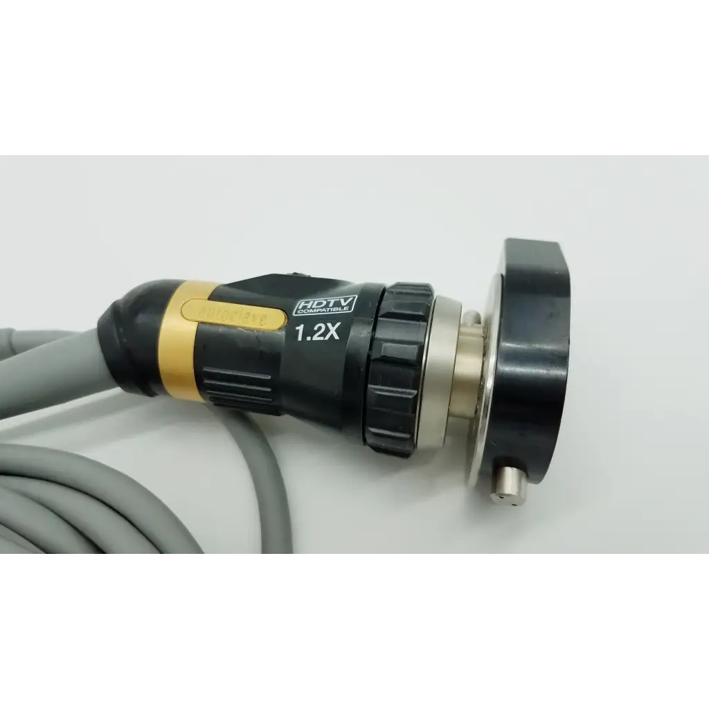 Black and gold olympus otv-s7proh-hd-12e autoclavable camera head with textured grip and metallic connector for hdtv use