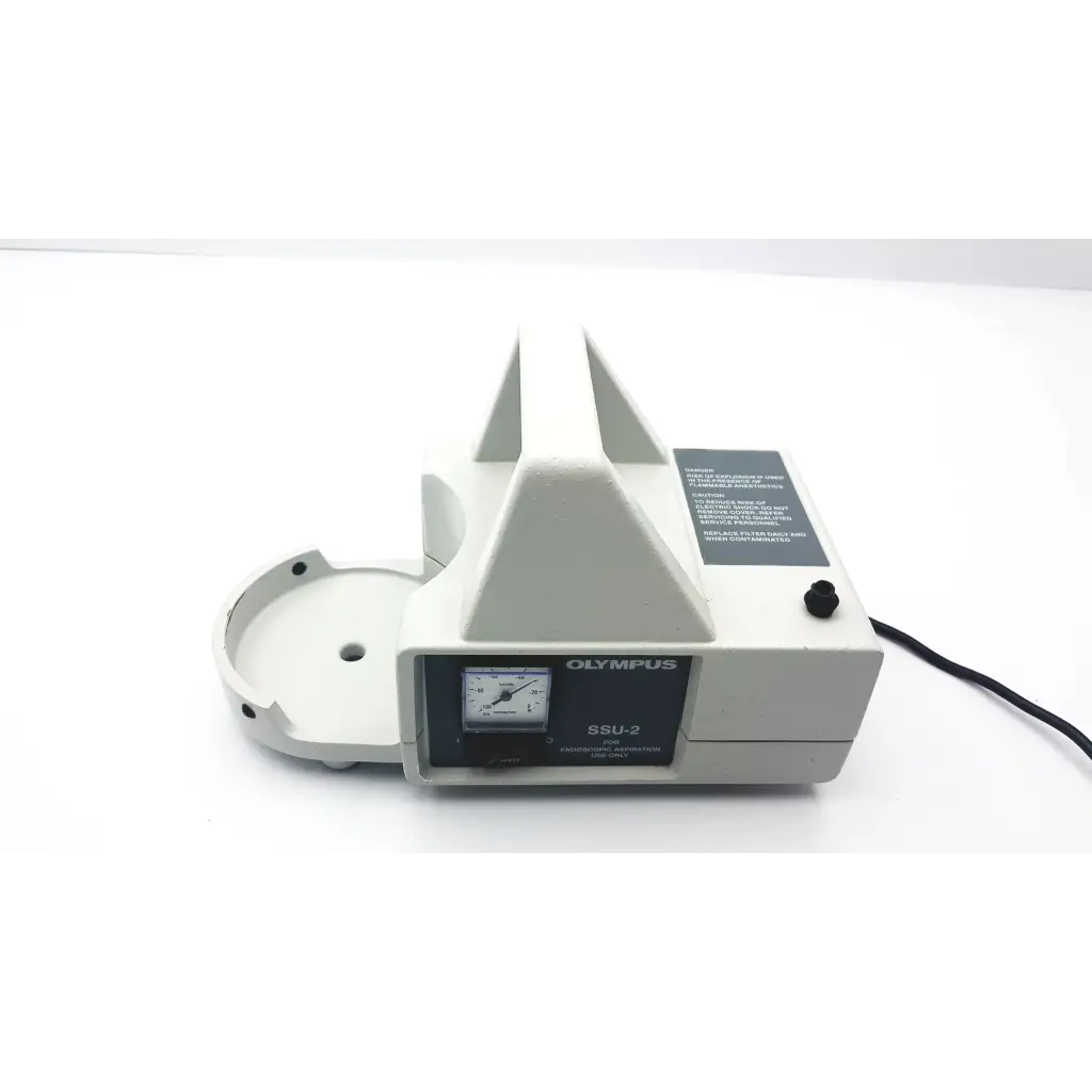 Olympus ssu-2 endoscopy suction slide scanner with beige plastic body and black control panel featuring analog dial
