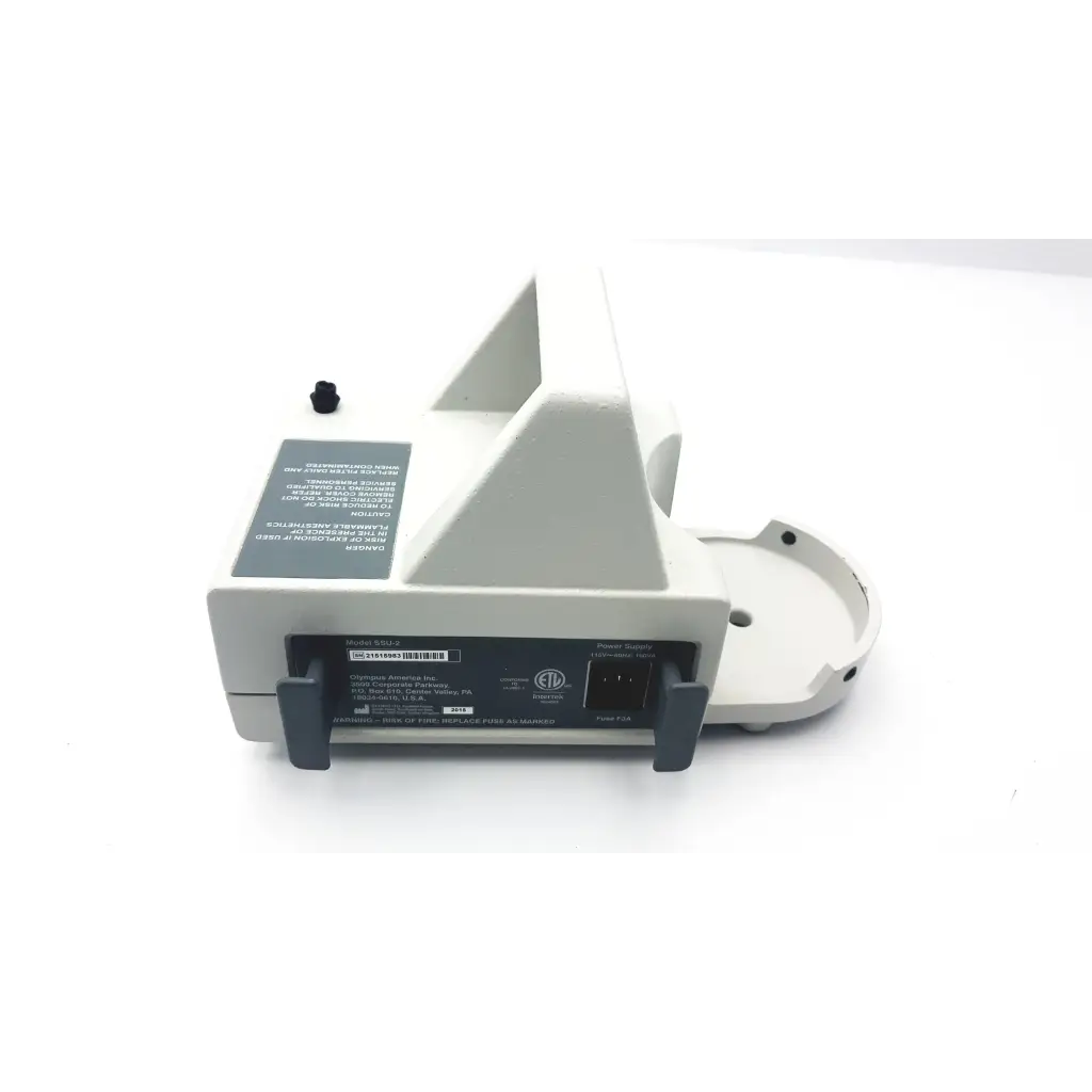 White plastic olympus ssu-2 endoscopy suction device with gray accents and black label on the back side