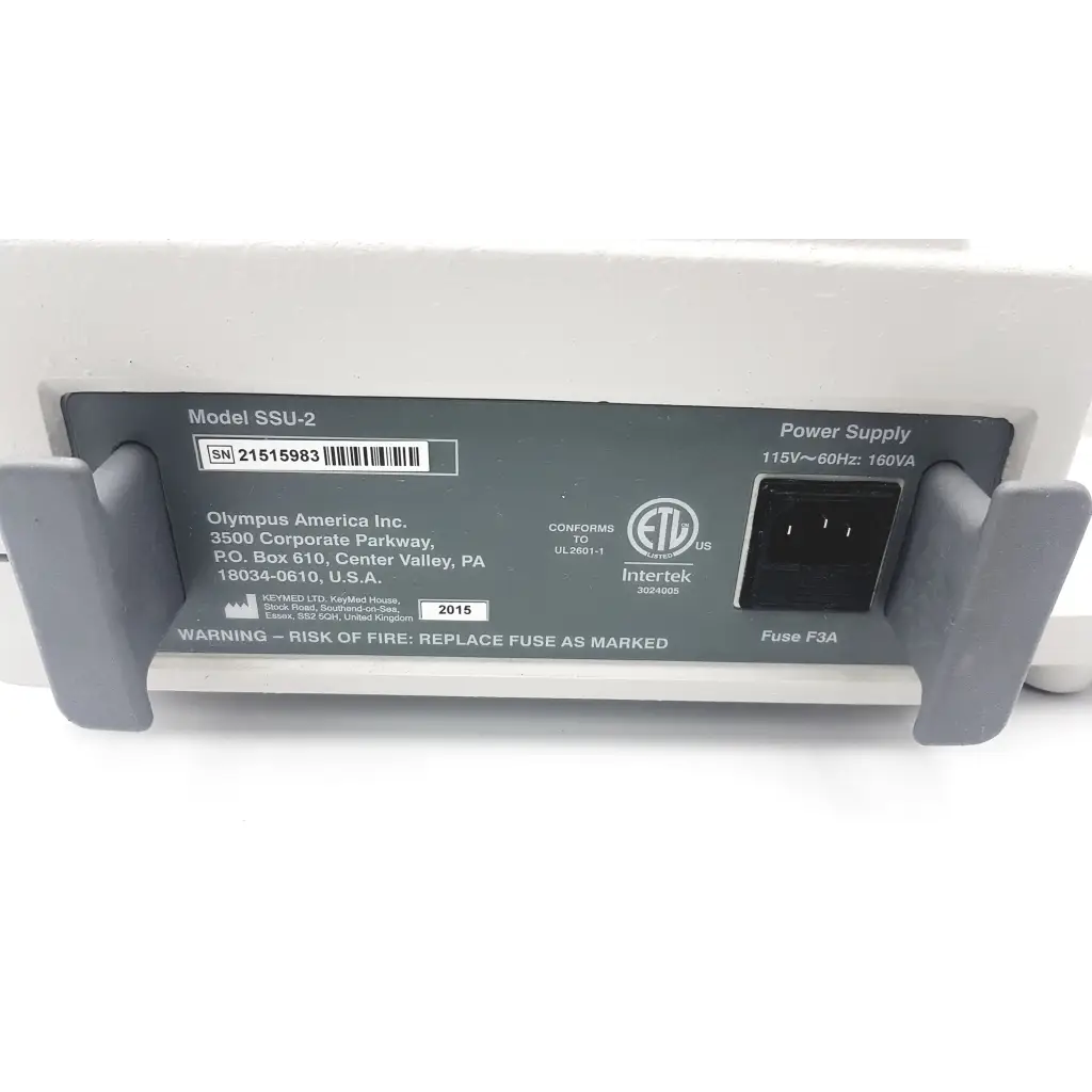 White plastic olympus ssu-2 endoscopy suction device with gray grips and black power input port model ssu-2 back view