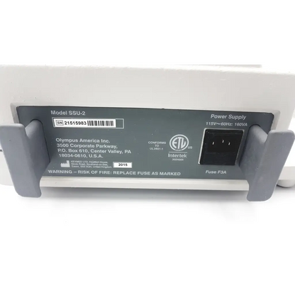 White plastic olympus ssu-2 endoscopy suction device with gray grips and black power input port model ssu-2 back view
