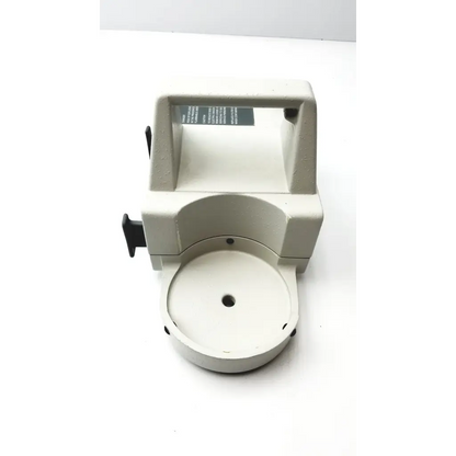Beige plastic paper cutter with black handle and circular cutting platform for olympus ssu-2 endoscope aspiration selling as-is