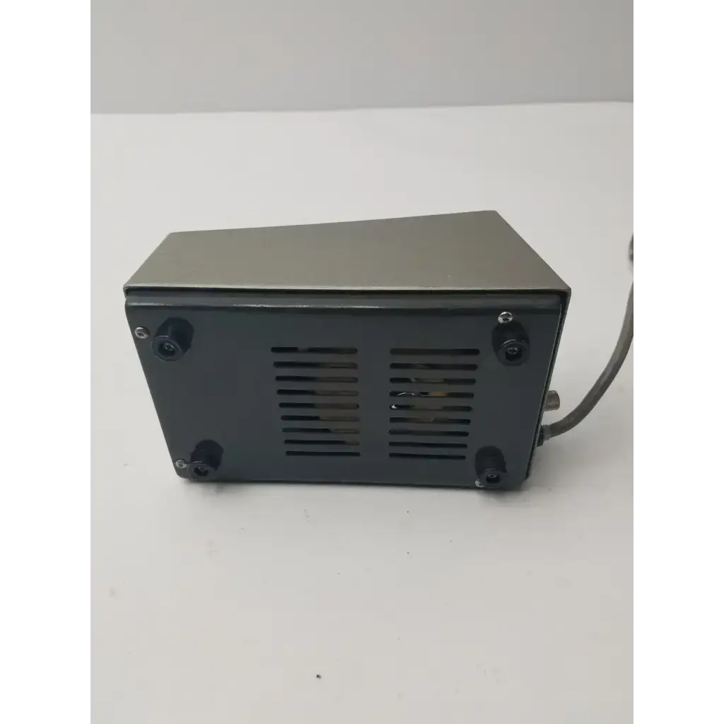 Dark gray rectangular back panel of olympus tokyo tf adjustable lamp power supply with vents and black rubber feet
