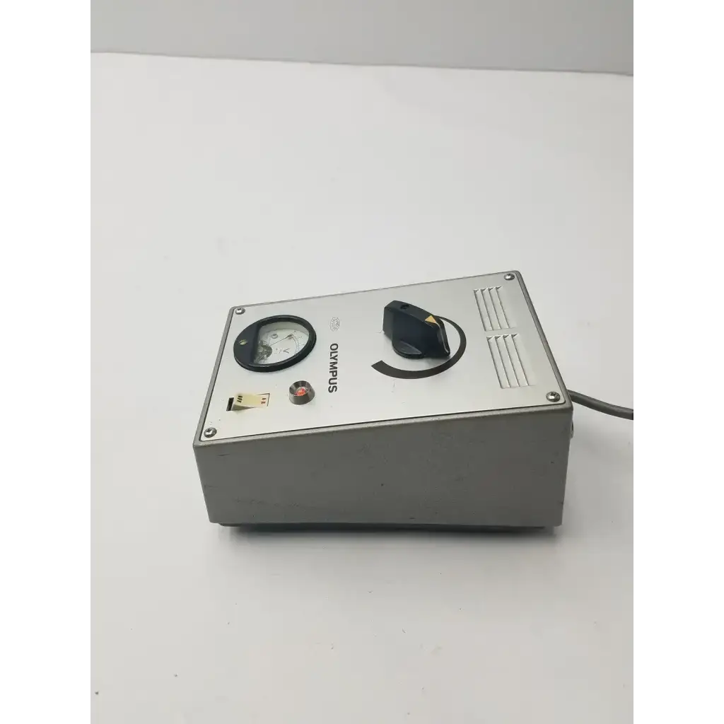 Silver metallic olympus tokyo tf adjustable lamp power supply with circular gauge black knob and red button for lamp power