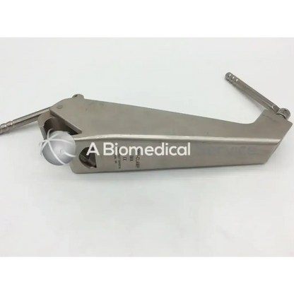 Silver metallic Omni-tract 3635 ima retractor rail clamp with white spherical component and engraved branding