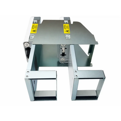 Silver metallic drawer slide mechanism with yellow warning labels on the biomed certified omnicell oral solid double dispenser