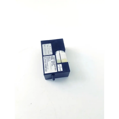 Dark blue rectangular omron healthcare m2600 automatic blood pressure module with white cylindrical component and labels