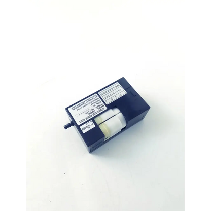 Dark blue plastic housing with two white cylinders and label showing model and specs of omron healthcare m2600 automatic blood module