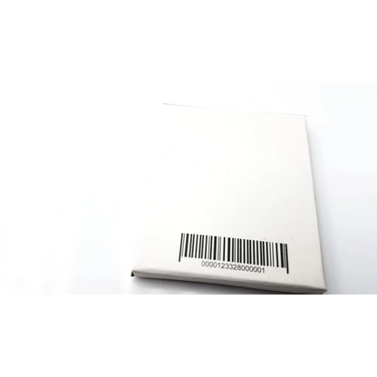 White rectangular box showing the back of oticon t-cap microphone cover for hearing aids in beige color with barcode