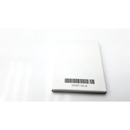White rectangular box showing the back side of oticon t-cap microphone cover for hearing aids in dark brown color