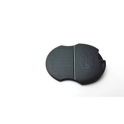 Black rubber lens cap with canon logo embossed, smooth matte finish, compatible with oticon t-cap hearing aids mid brown cover
