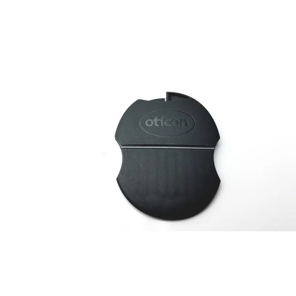 Black plastic oticon t-cap microphone cover for hearing aids with smooth rounded design and embossed logo