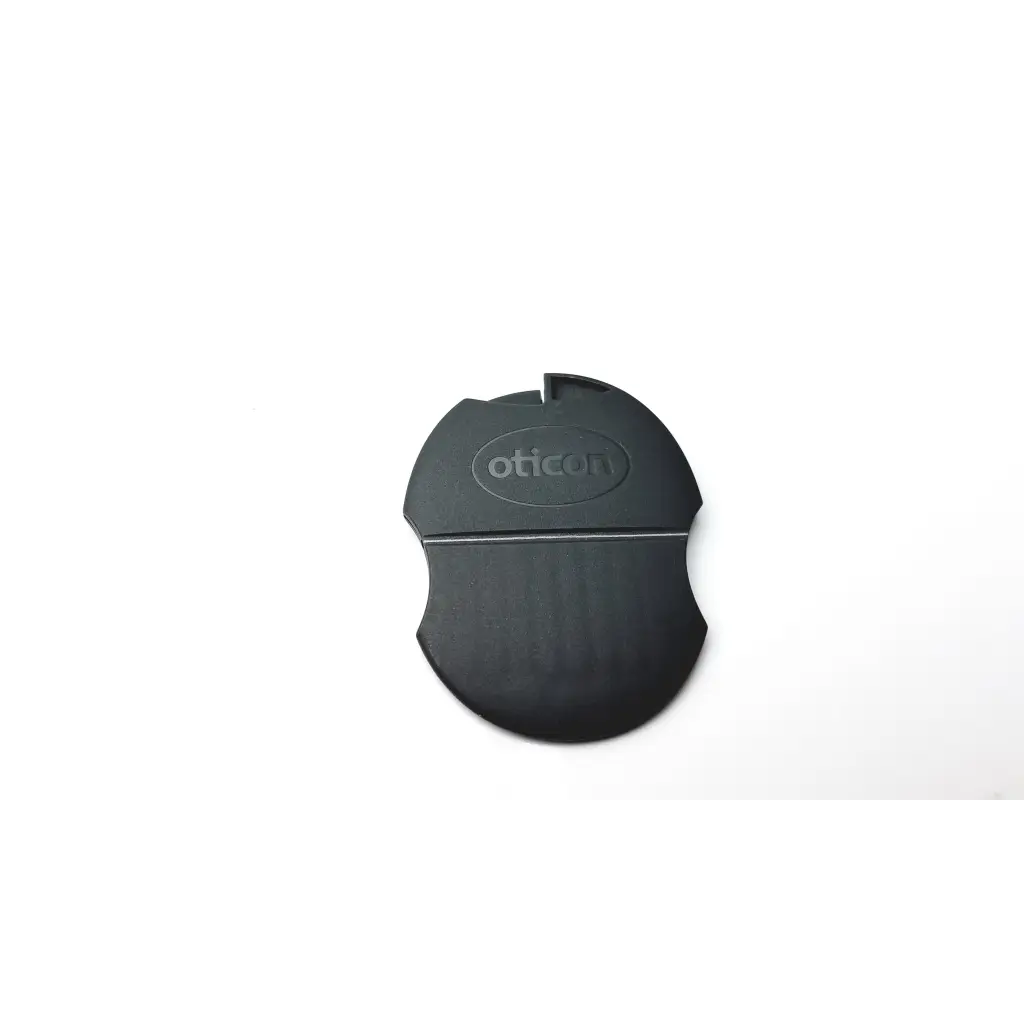 Black oticon t-cap microphone cover with a matte finish and oval design for hearing aids in mid brown