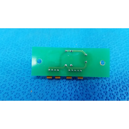 Green rectangular pow pcb power circuit board with silver solder connections and orange connectors for retinal camera