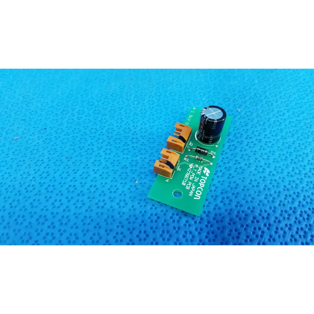Green power circuit board with orange terminal blocks and black capacitor for topcon retinal camera pow pcb model 4042766710