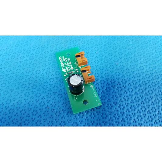Green pow pcb power circuit board with orange connectors and black cylindrical component for retinal camera use