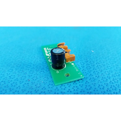 Black cylindrical capacitor on green pow pcb power circuit board with orange terminals for topcon retinal camera