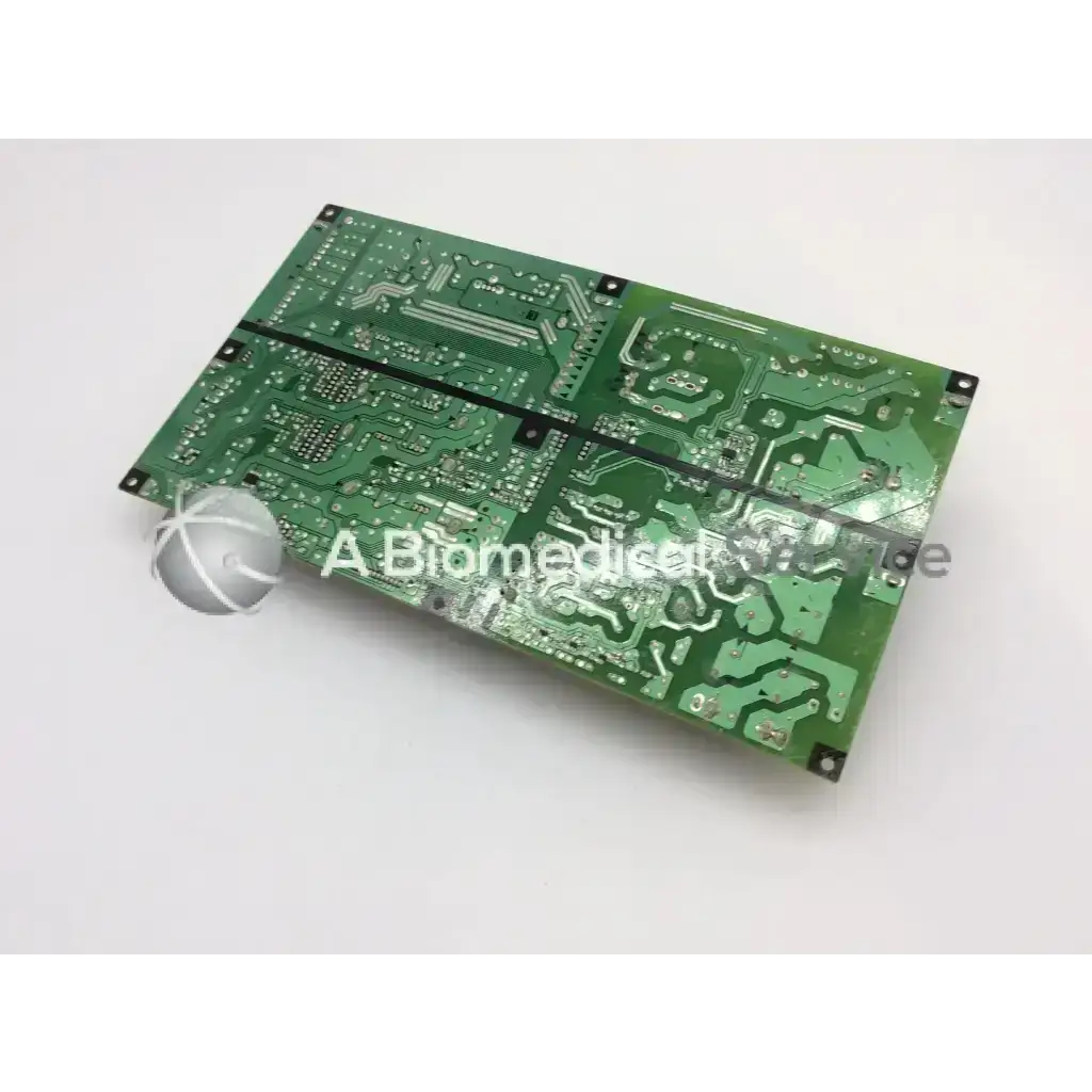 Green rectangular panasonic main power supply board with silver conductive traces and black mounting holes