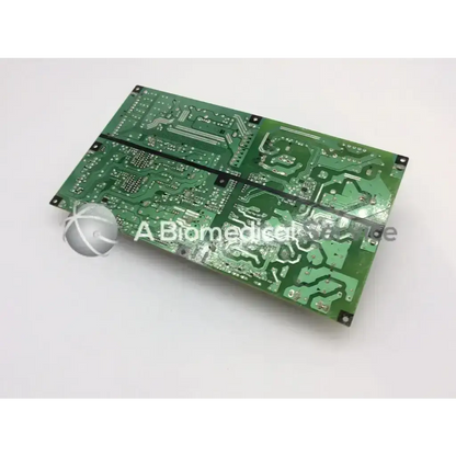 Green rectangular panasonic main power supply board with silver conductive traces and black mounting holes