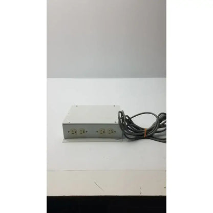 Silver metallic isolation transformer offset power strip with four outlets and coiled gray cord model ita0422 part no 11970-0000-01
