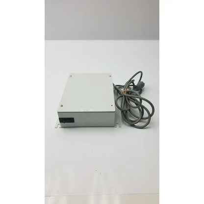 Gray rectangular isolation transformer offset controller unit with coiled gray cable part no 11970-0000-01 ITA0422