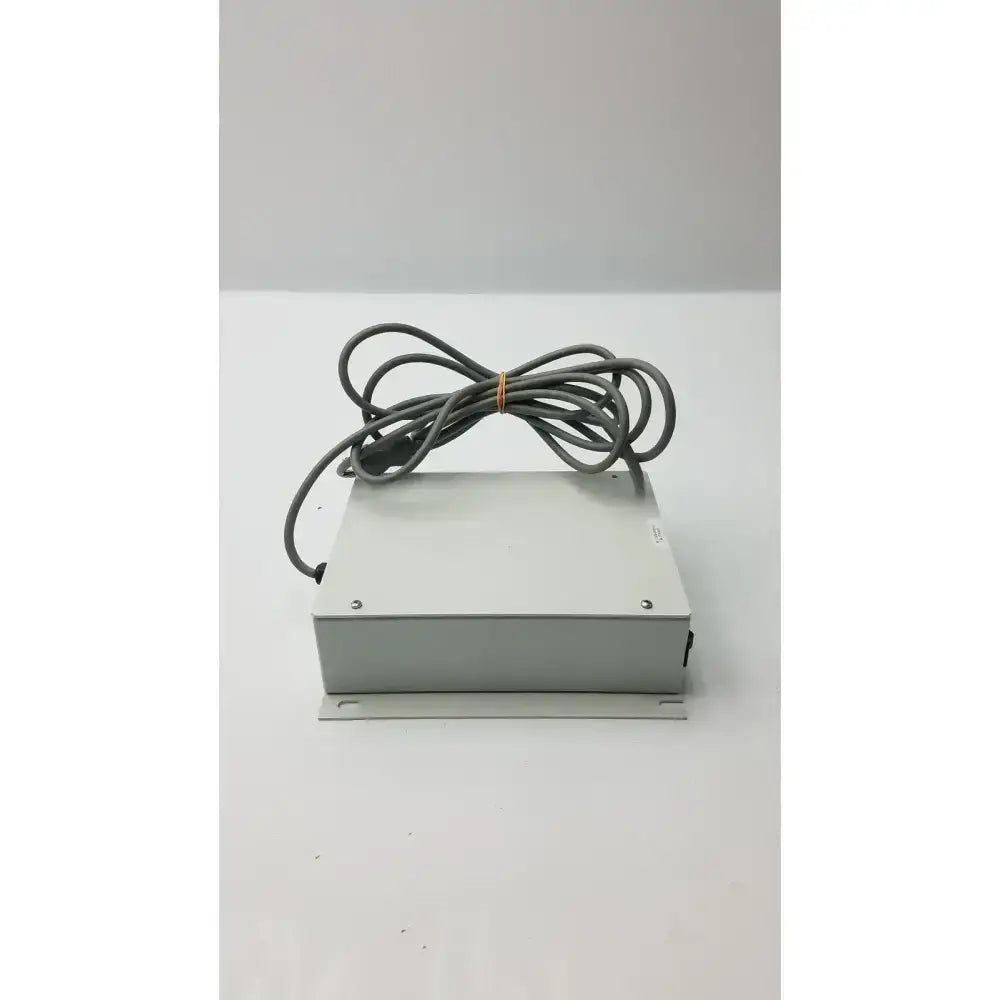 Gray rectangular isolation transformer offset controller itA0422 with coiled gray cable tied in a bundle