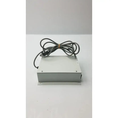 Gray rectangular isolation transformer offset controller itA0422 with coiled gray cable tied in a bundle