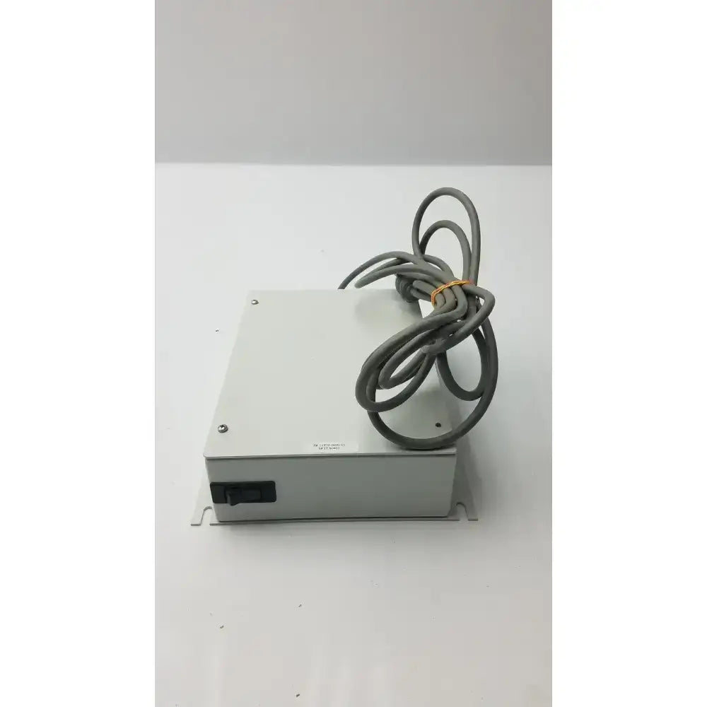 Gray metal isolation transformer offset controller with coiled gray cable secured by yellow tie part no 11970-0000-01