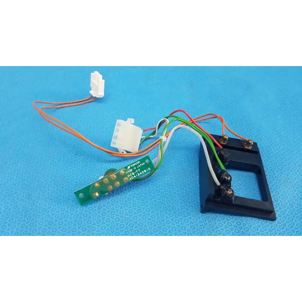 Black plastic housing with green circuit board and multicolored wires harness assembly for trc-nw6s retinal camera